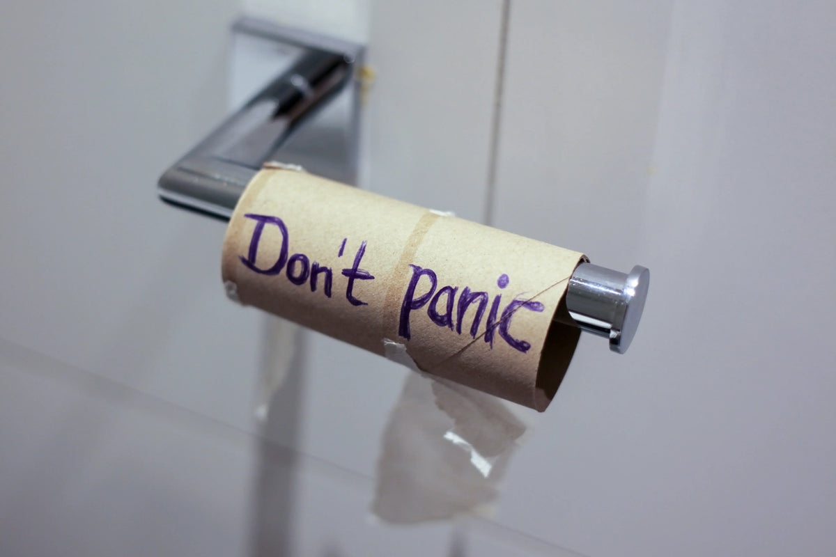 toilet paper roll that says "don't panic"