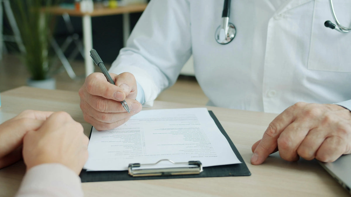 doctor taking notes on a clipboard