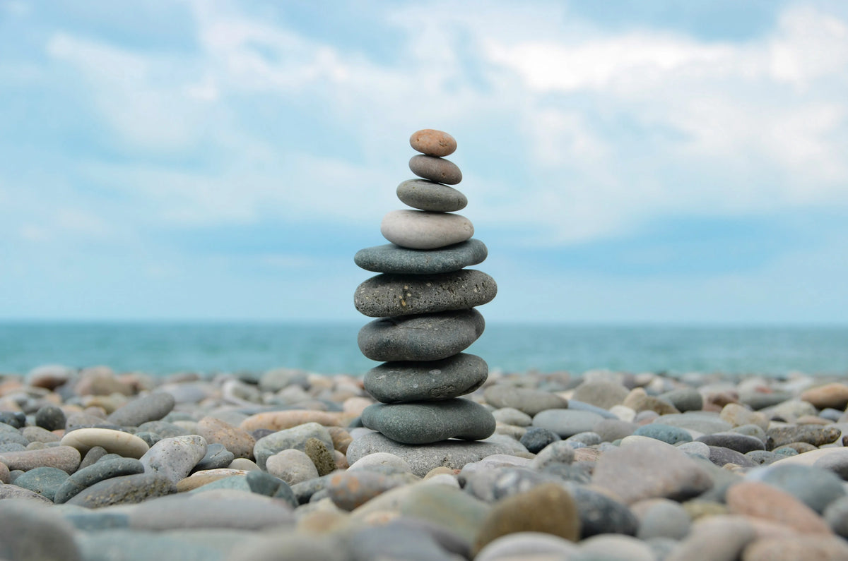 Stacked pebbles by the sea