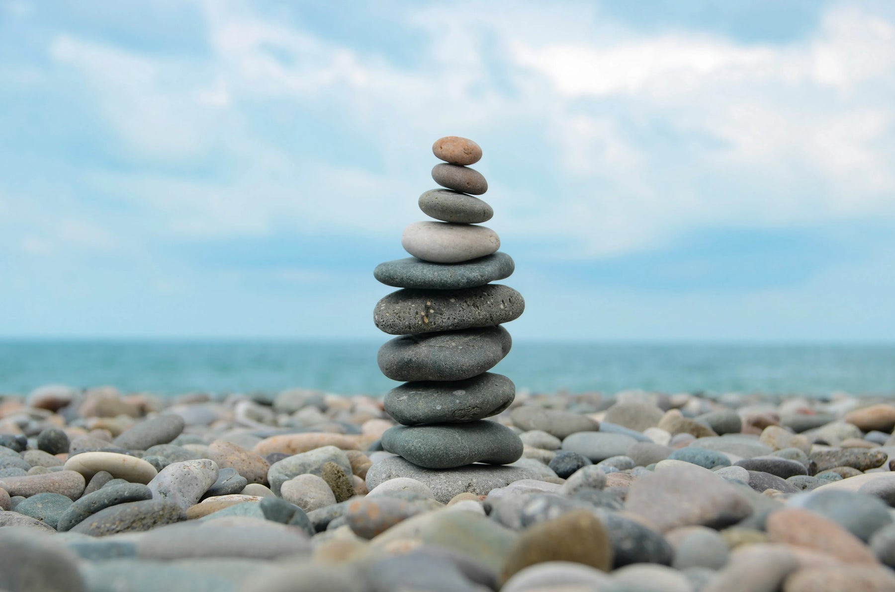 Stacked pebbles by the sea
