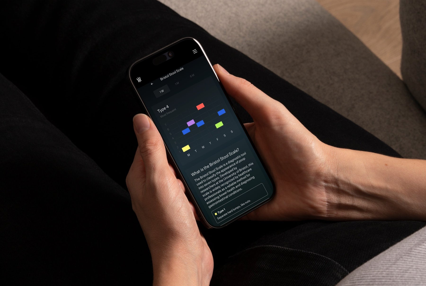 Hands holding a phone displaying the Throne app