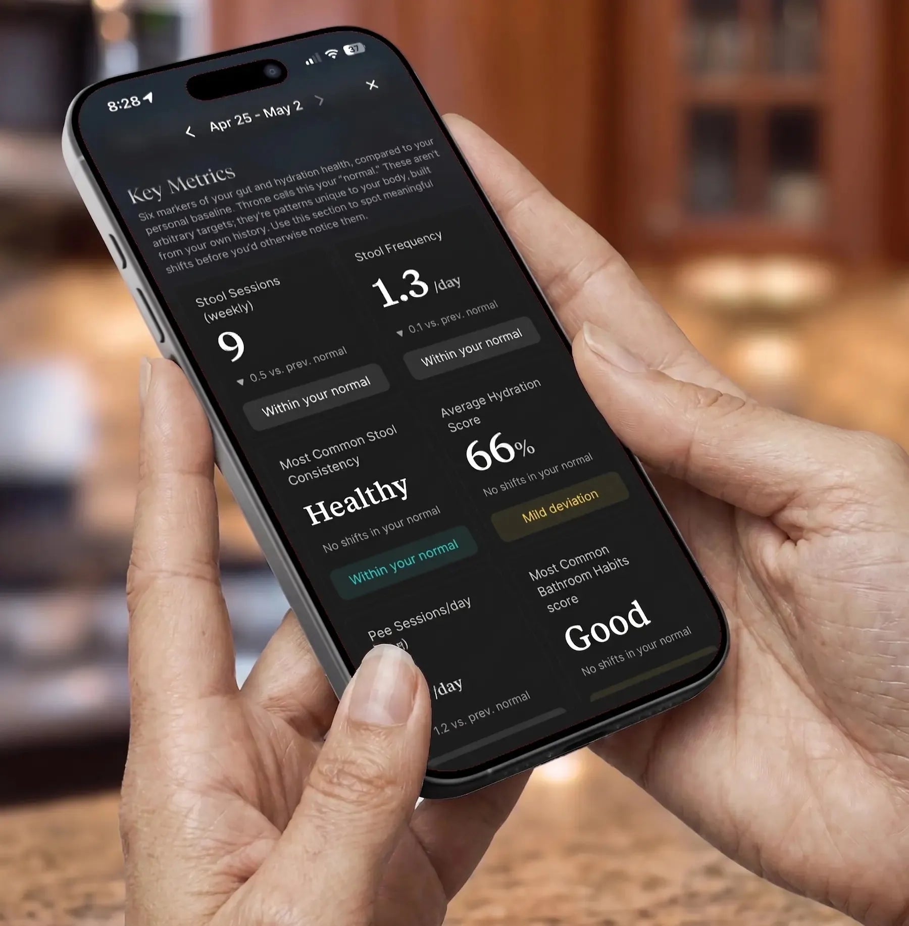 Hands holding a phone showing Throne's key metrics